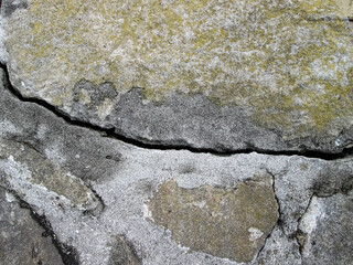 Crack in a gray granular slab..The stock effect of destruction and old age.