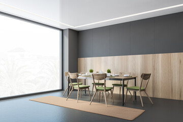 Grey and wooden dining room with chairs and table near window