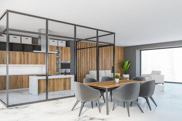 Big dining room with kitchen set and eating table with chairs near window