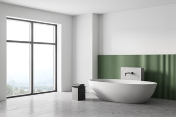 Fototapeta na wymiar White and green bathroom with white bathtub, marble floor and window