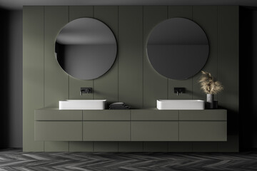 Grey and green bathroom with two sinks and mirrors, parquet floor