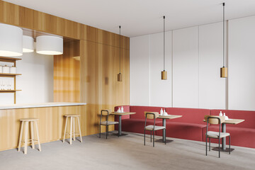 Wooden cafe with bar counter and red sofa with chairs and lamps