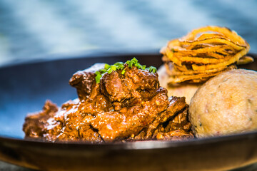 Game meat in red wine with dumplings.The food in the restaurant. Food styling and restaurant meal serving.