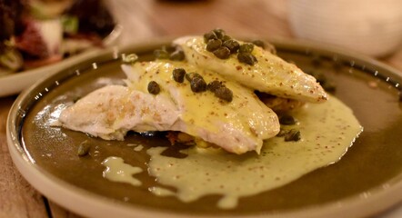 Seabass served with mustard and caper fruit