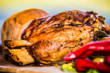 Pork knee with bread, cucumber and side dish. The food in the restaurant. Food styling and restaurant meal serving.