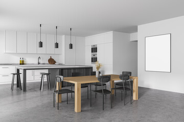 Modern kitchen interior with white walls, a concrete floor and gray countertops. A long table with chairs near it. mock up poster on wall.