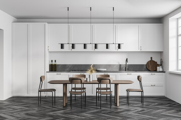 White kitchen set with eating table and chairs on black parquet floor