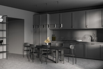 Dark grey kitchen set with eating table and chairs on marble floor