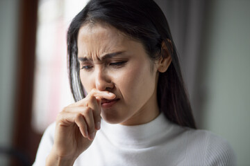 Fototapeta na wymiar allergic sick woman or girl with runny nose, flu or covid-19 symptom, health care concept