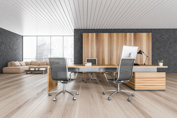 Wooden and black office room with armchairs and table with computer