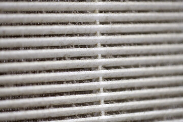Dirty air ventilation grill of HVAC with clogged filter.