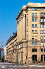 Obraz premium Marszalkowska 53 classic communist building of MDM quarter at Constitution square and Koszykowa street in Srodmiescie downtown district of Warsaw, Poland