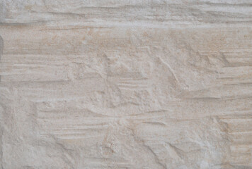 Textura de superfície de pedra com tons de cores de bege, rugosidades e desníveis