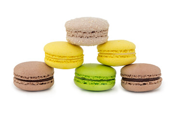 on a white isolated background multi colored cookies stacked in the form of a pyramid, a triangle. Macaron. Close-up, horizontal photo. The concept is delicious fresh baked goods.