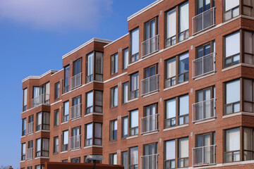 Fototapeta na wymiar small plain brown brick apartment building