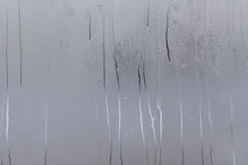 Window with condensate or steam after heavy rain, large texture or background.