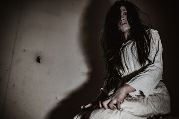 Portrait of asian woman make up ghost,Scary horror scene for background,Halloween festival...