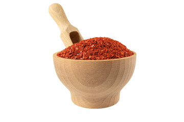 chilli pepper seedless flakes in wooden bowl and scoop isolated on white background. Spices and food ingredients. in Korea known as Gochugaru. Used for Kimchi.