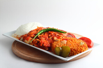 Turkish cuisine. Doner kebab meat with pommes frites potatoes and salad on plate isolated on white background