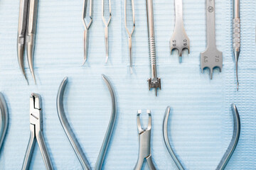 Dental tools for the orthodontic treatment lying on the table at the dental office, close-up. High quality photo
