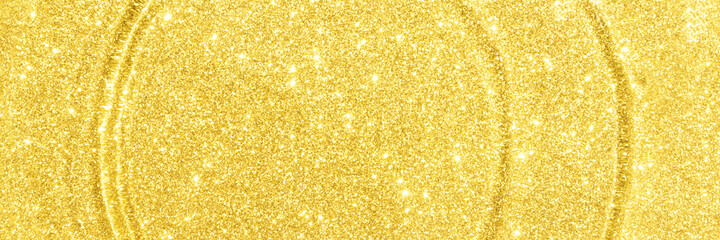 Water circle with gold sparkles background. Yellow glitter backdrop. Golden texture. New year luxury snow. Copyspace. Shimmer confetti wallpaper. Dreamy shiny design detail. Banner