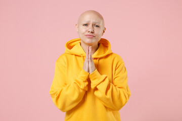 Young bald caucasian pleaded trustful woman 20s without hair in yellow casual sweatshirt shirt...