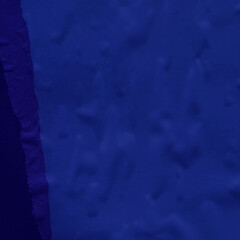 Blue and violet torn paper collage close-up. Texture made from various paper and cardboard parts. Damaged old paper background. Vintage blank wallpaper. Material design backdrop.