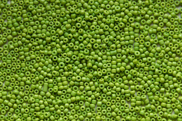 Green beads background, close up