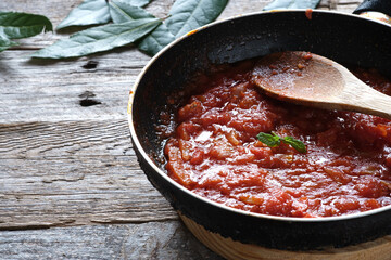 Homemade crushed tomato on frying pan
