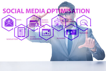 Social media optimisation concept with businessman