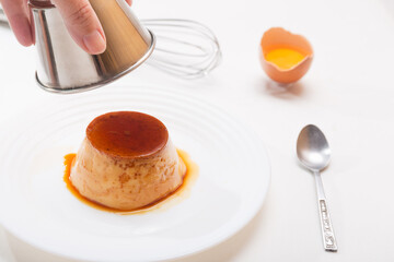 Unmolding homemade egg custard lactose-free dessert