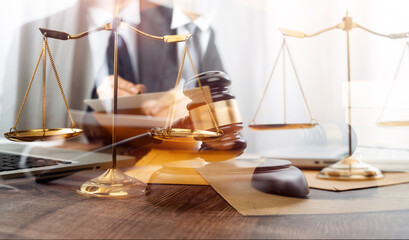 Business and lawyers discussing contract papers with brass scale on desk in office. Law, legal...