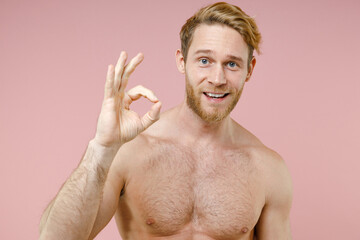 Smiling cheerful bearded naked young man 20s years old perfect skin showing ok okay gesture...