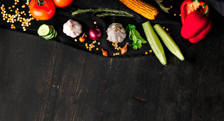 Fresh vegetables on wooden background. Organic food from farm. Mixed vegetables