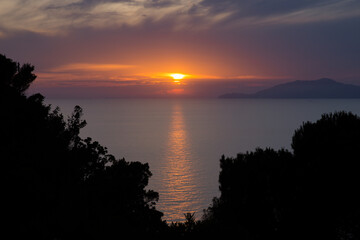 Fototapeta na wymiar Breathtaking sunset on the Island of Capri. Beautiful sunset on the island of Capri with a view of the island of Ischia, Tyrrhenian sea, Italy