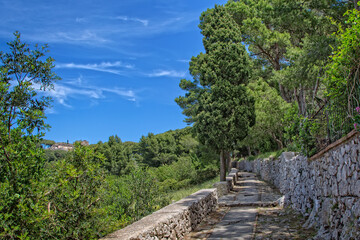 Fototapeta na wymiar Steps leading to Villa Jovis in Capri. The ruins of Villa Jovis built by emperor Tiberius is located at the edge of a tall cliff on the island of Capri, Tyrrhenian sea, Italy