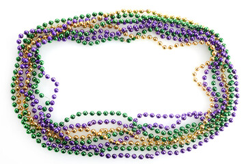 A frame of three colors of Mardi gras beads on white background - obrazy, fototapety, plakaty
