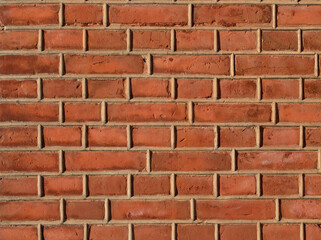 A brick wall with convex mortar between bricks