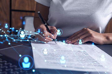 A potential employee signing the contract to boost her career and gain new opportunities in personal growth. Hiring a new talented crew. Social media hologram icons. Women in business concept.