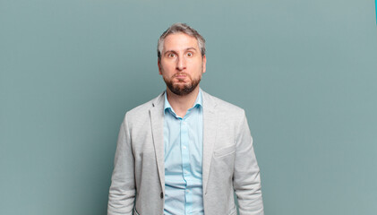 adult businessman with a goofy, crazy, surprised expression, puffing cheeks, feeling stuffed, fat...