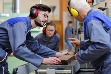 instructor talking to trainee in workshop