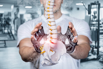 Young athlete protects the spine with a hand gesture .