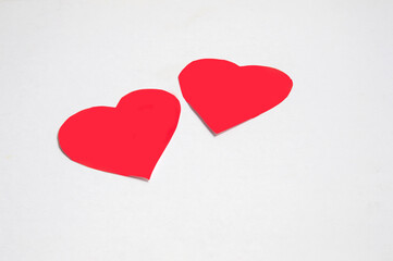 Fototapeta premium two red paper hearts isolated on white background