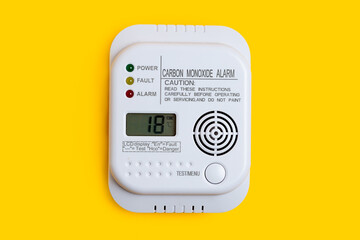 Carbon monoxide detector on a yellow background CO detector