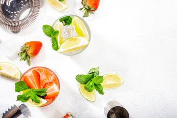 Mojito mocktail set with lime, mint, strawberry and ice on white background. Cold alcoholic non-alcoholic long drinks, beverages and cocktails