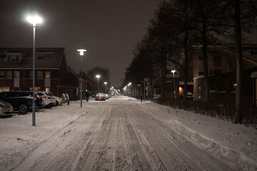 Dutch suburb on a snowy night during second lockdown after curfew (February, 2021)