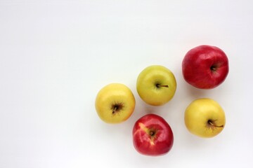 Red and green apple on white background. Overhead view of fresh fruits on the table. Copy space