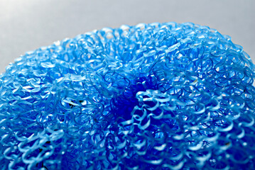 Close-up of a round sponge woven from fishing line.