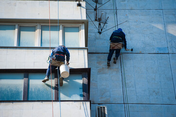 Climbers perform construction work