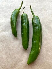 Raw green peppers on a light paper background Ready to Use